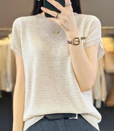 Blusa feminina em tricot texturizado sem costura, confortável e elegante, ideal para trabalho e lazer.